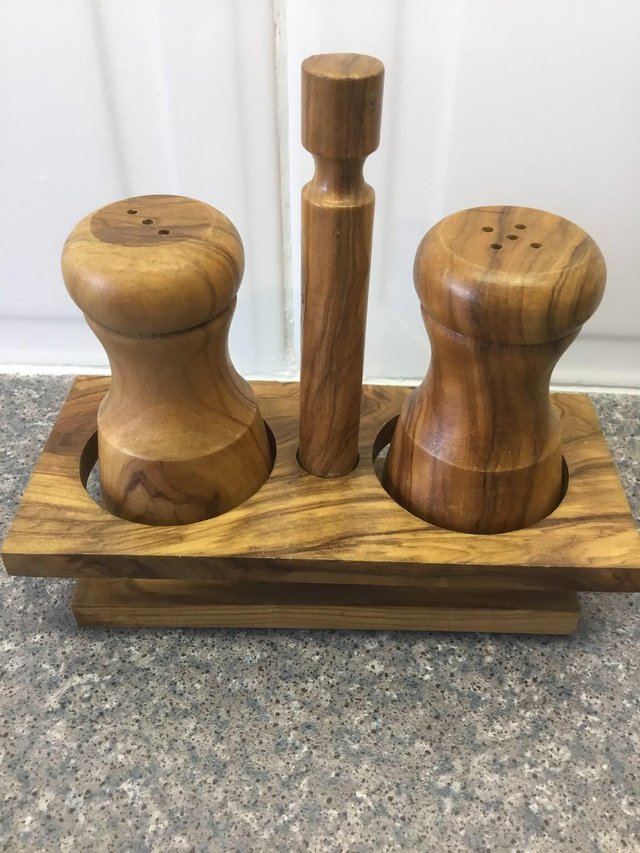 Preview of the first image of New Olive wood salt and pepper pots in stand.
