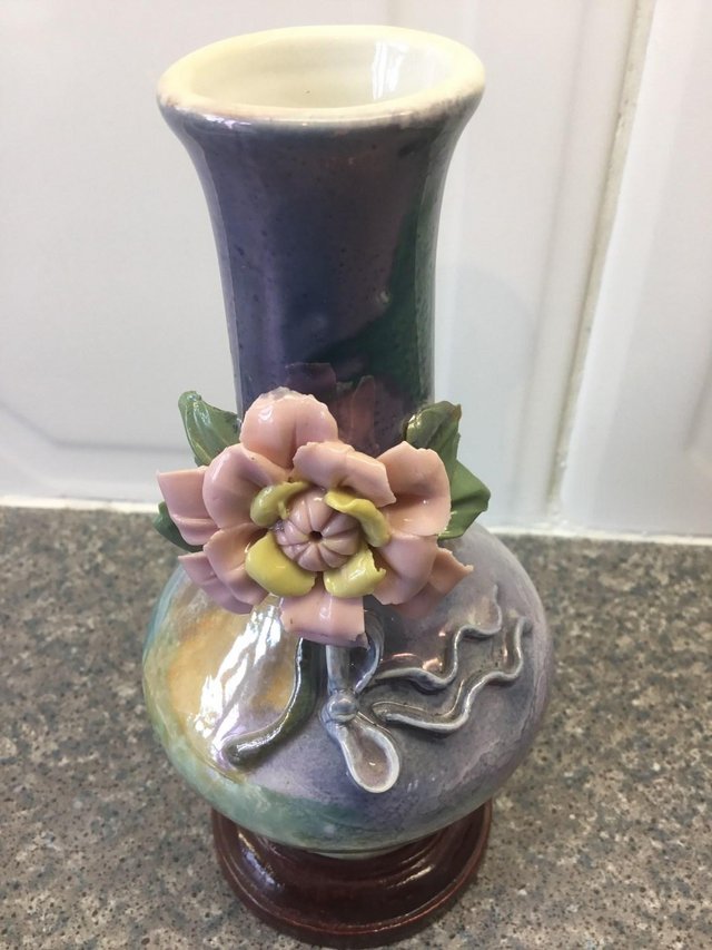 Preview of the first image of Brand new Decorative Vase with pink flower on the front.