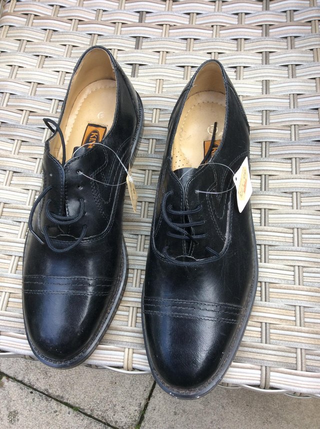 Preview of the first image of Brand new men’s black real leather shoes..