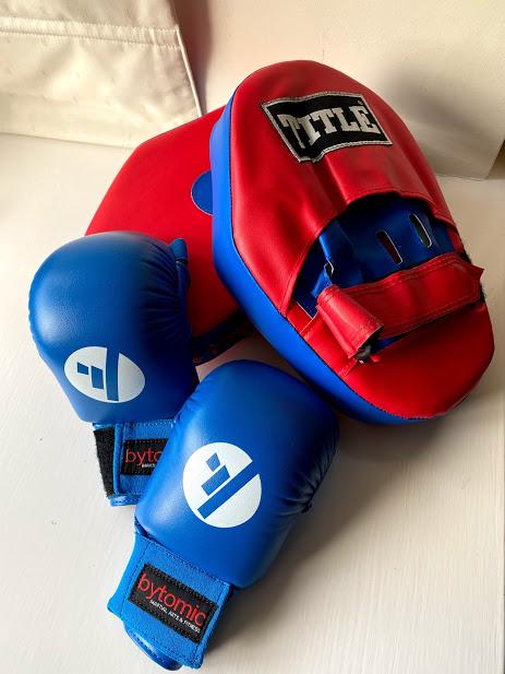Preview of the first image of TITLE Boxing Pads & Bytomic Gloves.