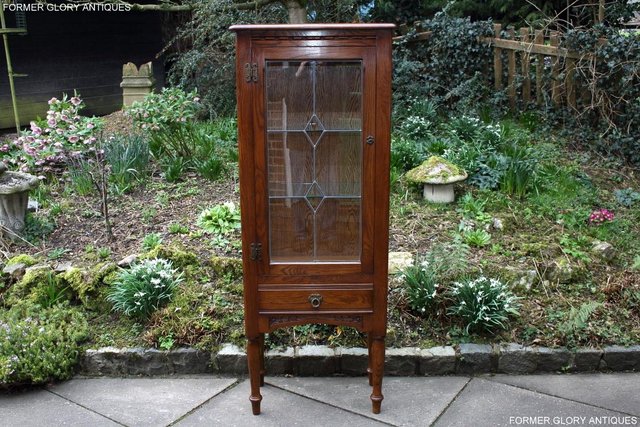 Preview of the first image of AN OLD CHARM MINUET LIGHT OAK CHINA DISPLAY CABINET STAND.