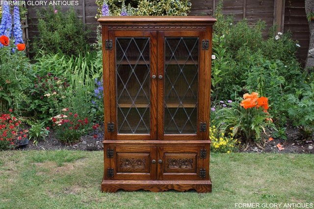 Preview of the first image of AN OLD CHARM LIGHT OAK BOOKCASE DVD CD DISPLAY CABINET STAND.