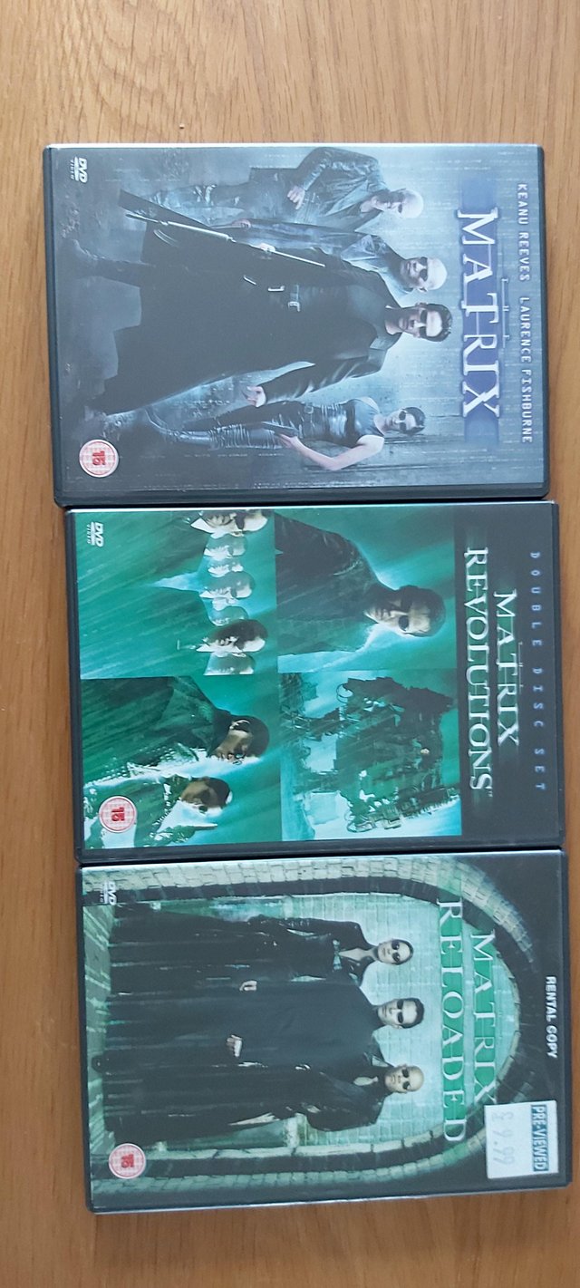 Preview of the first image of The Matrix trilogy DVD set for sale.