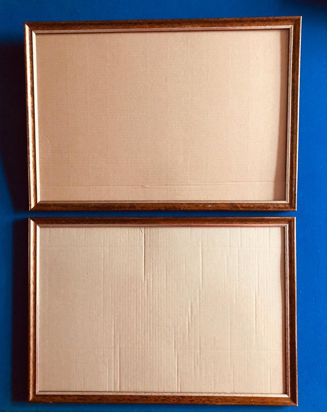 Preview of the first image of PAIR OF WOODEN PICTURE FRAMES WITH GLASS.