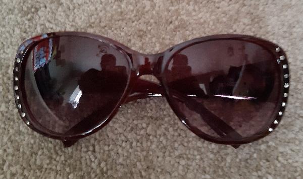 Preview of the first image of Lovely Ladies Burgundy Sunglasses With Diamante Decoration.