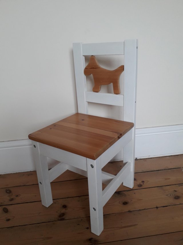 Preview of the first image of CHILDS PINE CHAIR WITH DOG CHARACTER BACK.