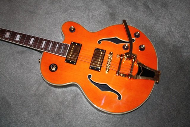 Preview of the first image of Rockabilly Orange Electric semi-Acoustic Guitar.
