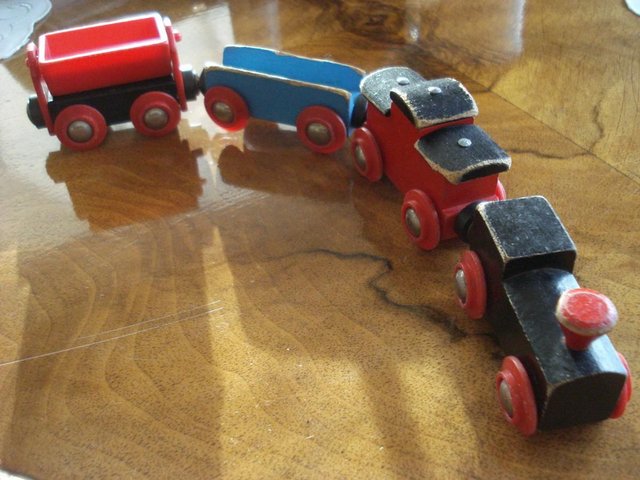Preview of the first image of VINTAGE MAGNETIC WOODEN TOY TRAIN SET, SET OF 4.