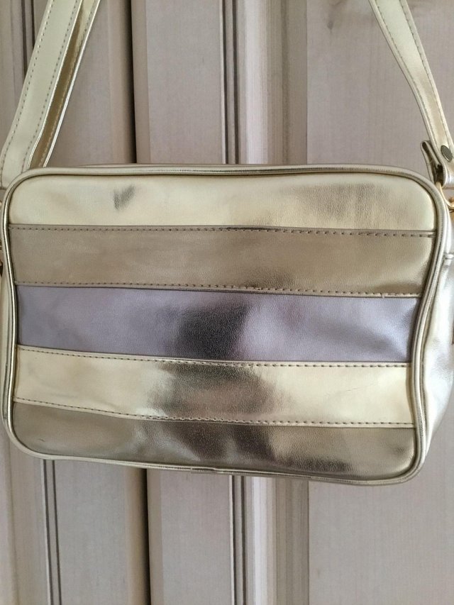 Preview of the first image of New Gold Handbag.