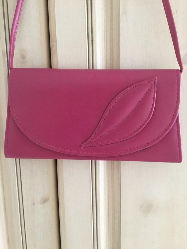 Preview of the first image of Dark dusty pink smart handbag.