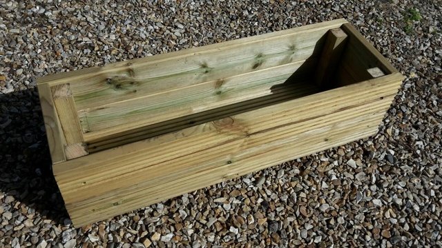 Preview of the first image of WOODEN DECKING PATIO GARDEN PLANTER HERB TROUGH 900MM X 300M.