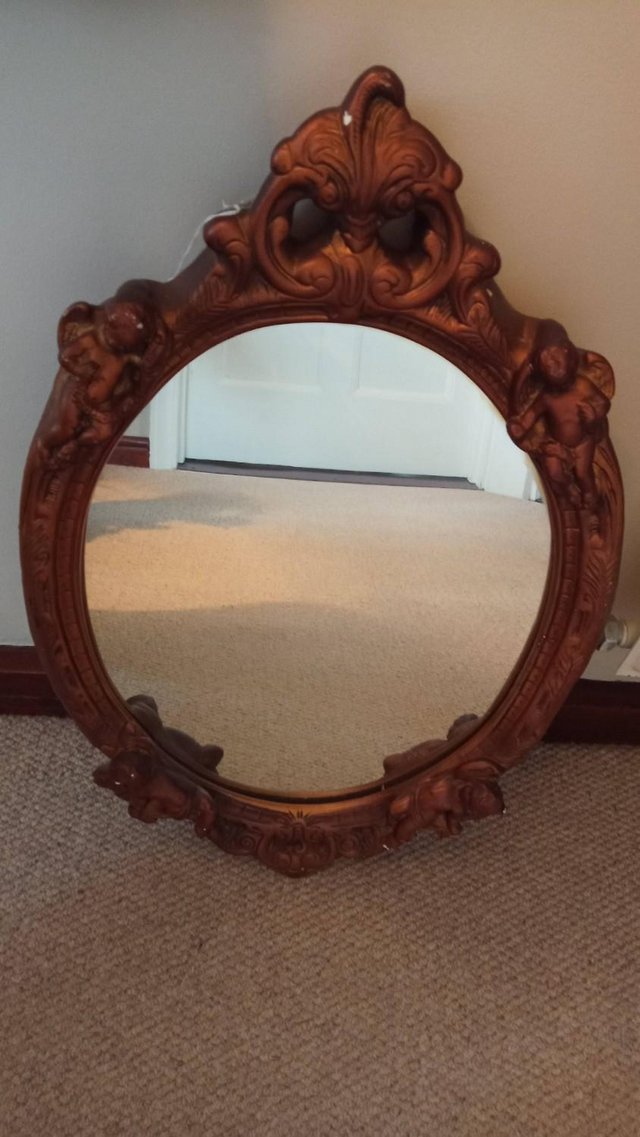 Image 2 of Oval Cherub mirror in gold dated from the 1970's
