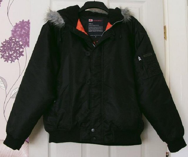 Preview of the first image of Lovely men's black winter jacket by Le Shark - Size L.
