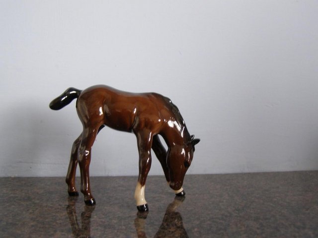 Preview of the first image of Royal Doulton Grazing foal DA76.