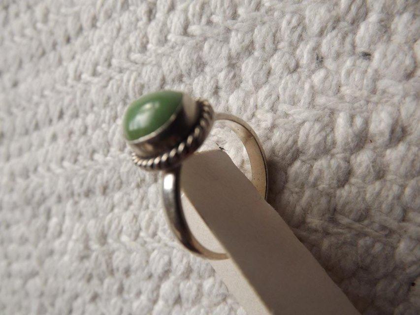 Preview of the first image of Green jade ring in silver mount, adjustable.