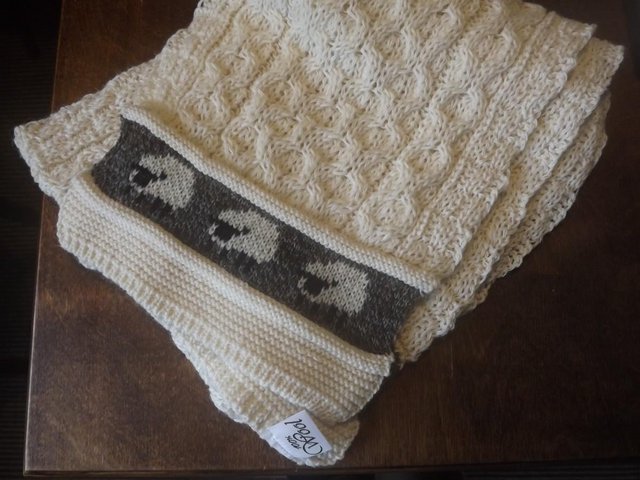 Preview of the first image of Knitted Woollen Scarf with sheep design.