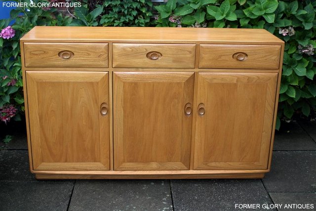 Preview of the first image of ERCOL LIGHT ELM WINDSOR HIGH SIDEBOARD DRESSER BASE CABINET.