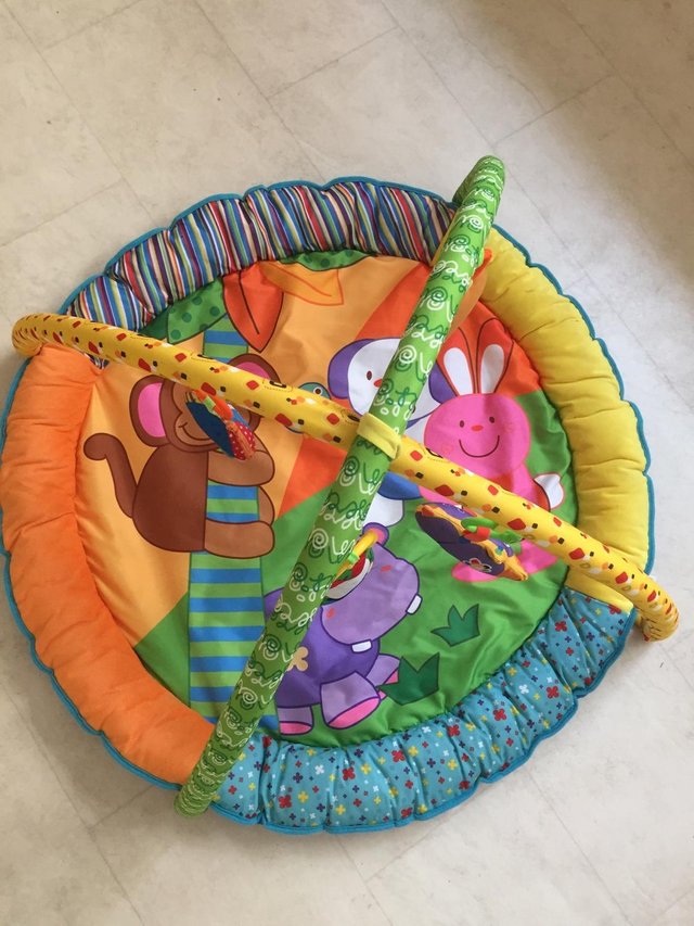 Preview of the first image of Baby floor mat and mobile.