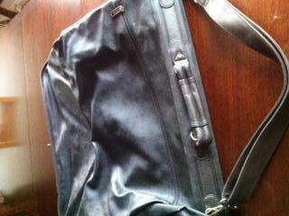 Preview of the first image of Black leather men's suit carrier.