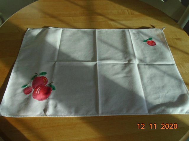 Preview of the first image of Hand appliqued white cotton tea towel with apple motif.