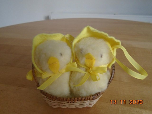 Preview of the first image of Two plush toy chicks in a basket.