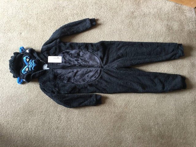 Preview of the first image of Brand new age 11-12 M & S black fluffy gorilla onesie.