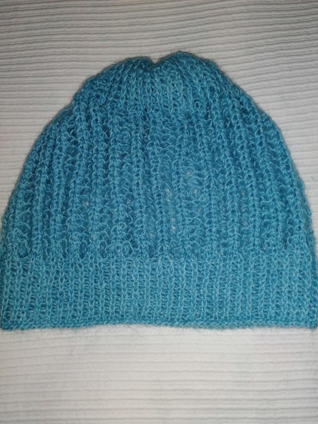 Preview of the first image of LADIES KNITTED SOFT HAT BABY BLUE.