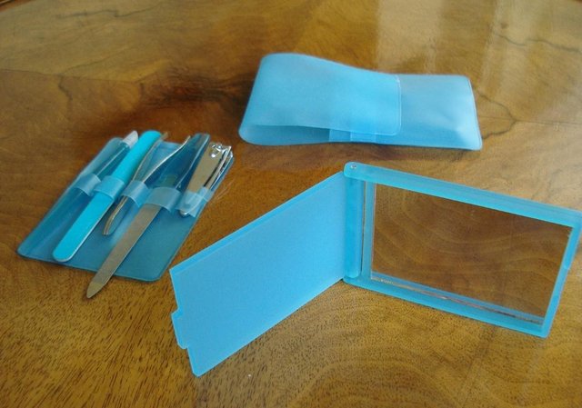 Preview of the first image of NEW BLUE TRAVEL GROOMING KIT MANICURE, TWEEZERS, MIRROR ETC..