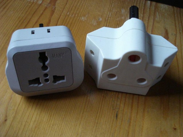 Preview of the first image of NEW 2 x UNIVERSAL PLUG TRAVEL ADAPTORS FOR UK & ABROAD.