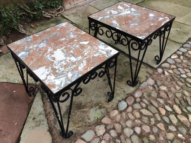 Preview of the first image of A pair of marble and iron side tables..