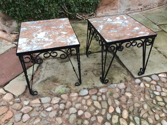 Image 2 of A pair of marble and iron side tables.