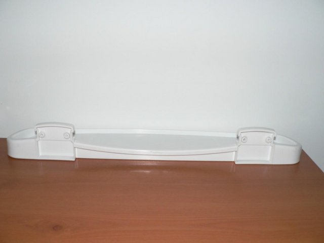 Preview of the first image of Single white plastic wall shelf.