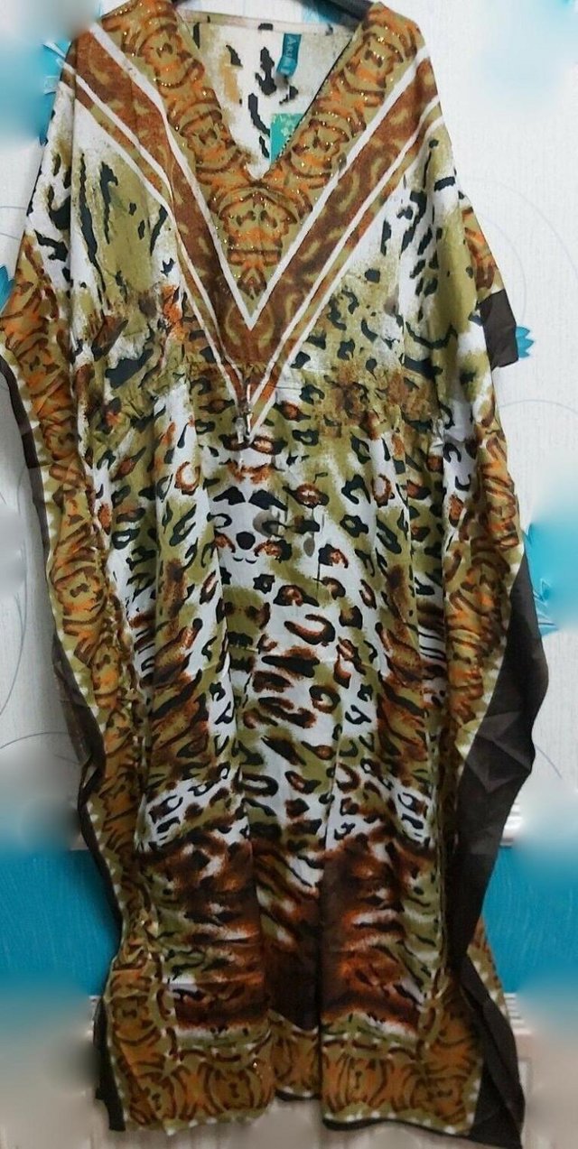 Preview of the first image of Brand New withTags Ladies Leopard Print Kaftan.