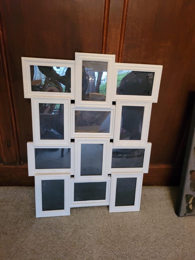 Preview of the first image of Large white picture frame 12 photo spaces - 6x4cm.