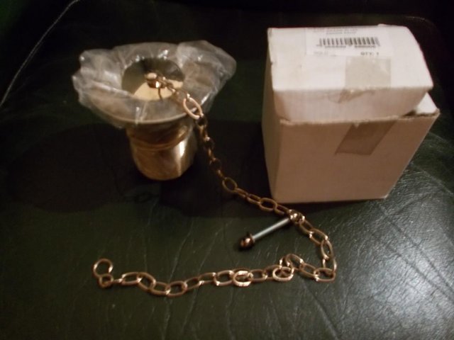 Preview of the first image of Used, solid brass, bathroom waste with link chain.