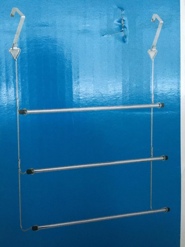 Preview of the first image of Over door towel rack chrome.