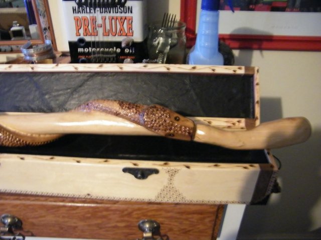 Preview of the first image of HAND CARVED SNAKE WALKING STICK WITH WOOD CASE.
