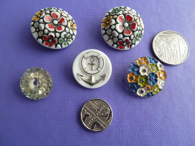 Preview of the first image of 5 attractive vintage collectible glass buttons.