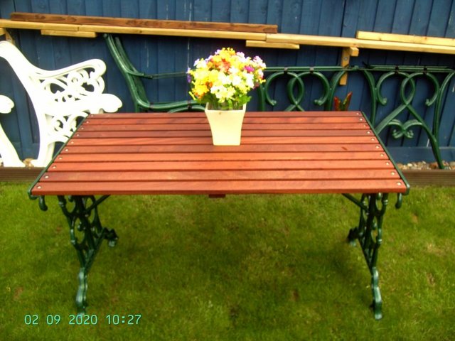 Preview of the first image of (63) Cast Iron & Sapele Hardwood Garden Table.