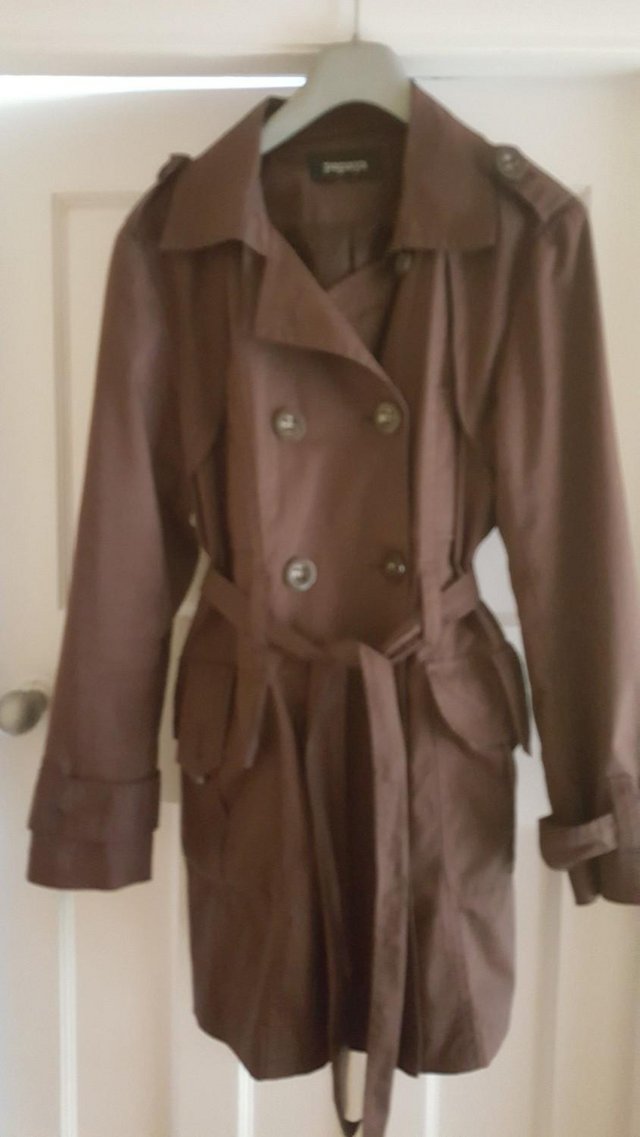 Preview of the first image of Ladies rain coat size 16.