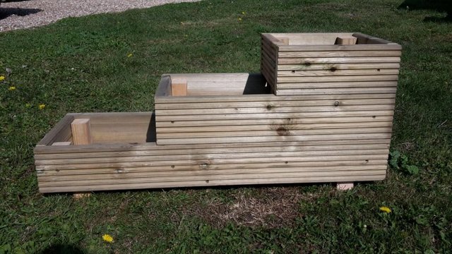 Preview of the first image of WOODEN 3 TIERED DECKING PATIO GARDEN PLANTER 900MM X 300MM.