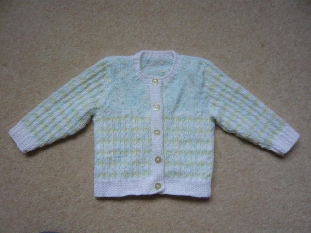 Preview of the first image of Brand new hand knitted, cardigan / jacket for baby girl.