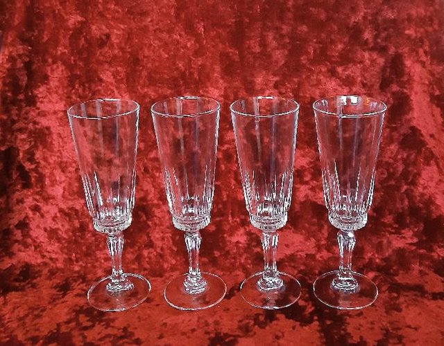 Preview of the first image of 4 Tall Crystal Glass Flute Glasses.
