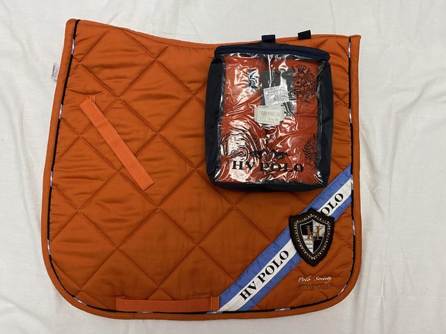 Preview of the first image of HV Polo flame (orange) dressage pad and bandages size full.