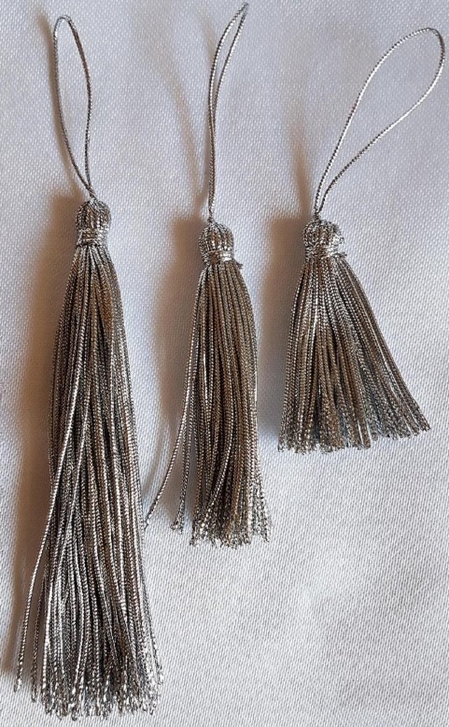 Preview of the first image of 12 New Assorted Silver Tassels, 3  lengths.