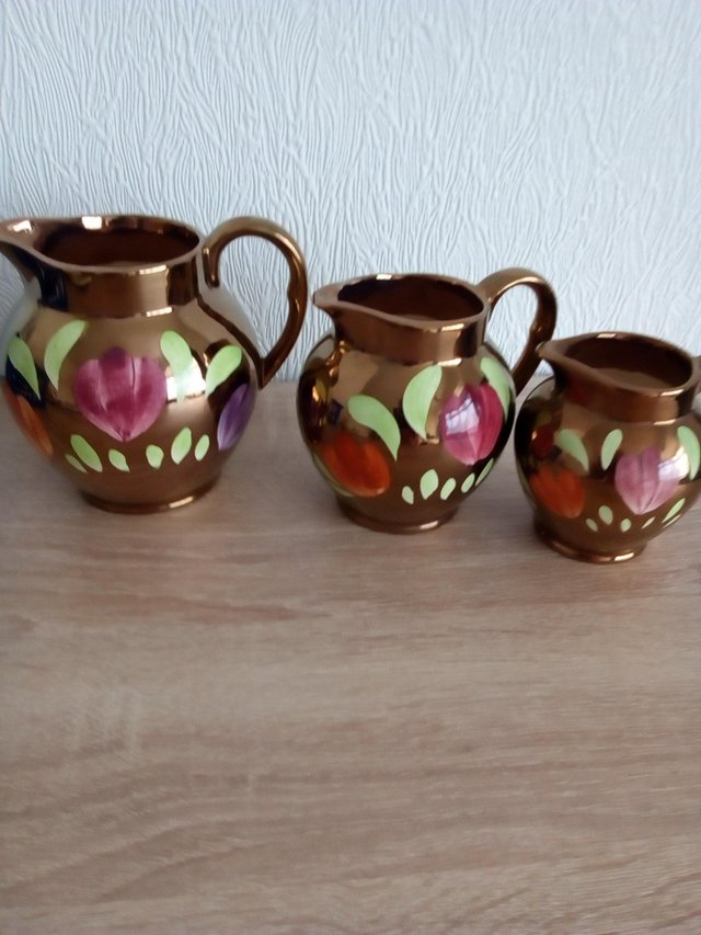 Preview of the first image of OLDCOURT WARE GOLD LUSTRE FLORAL JUGS.