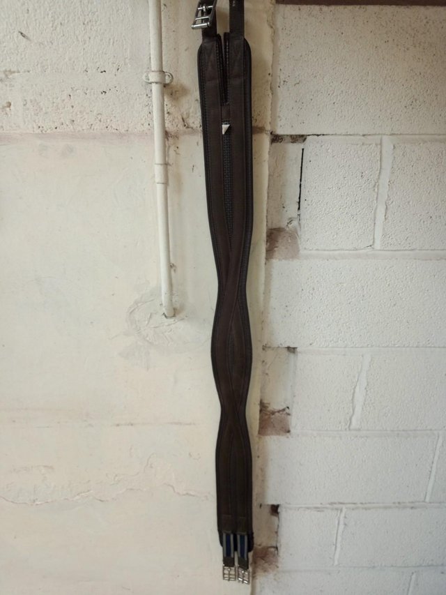 Preview of the first image of Shaped Girth Brown  Elastic one End 54ins.