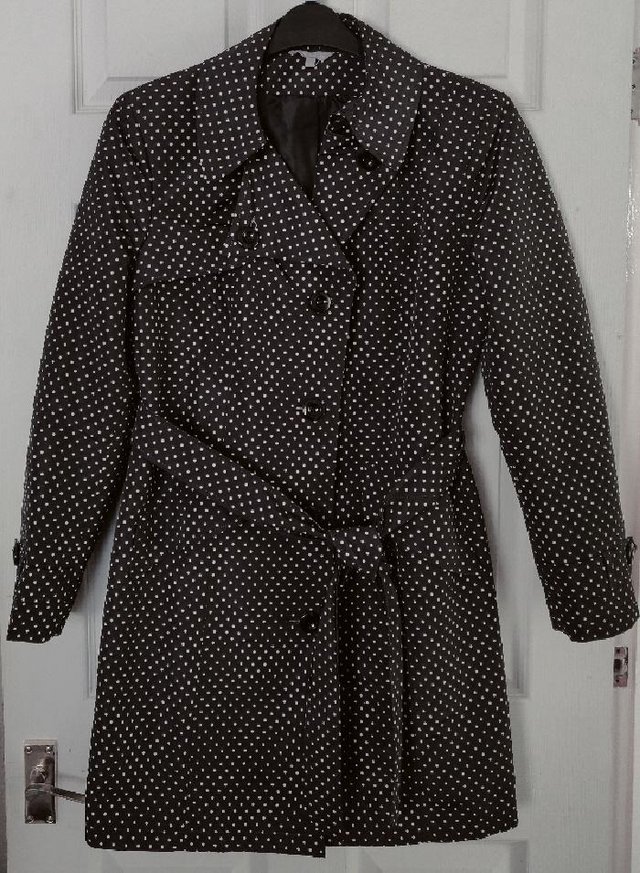 Preview of the first image of Ladies Black/White Polka Dot Coat By M&S - Size 12.
