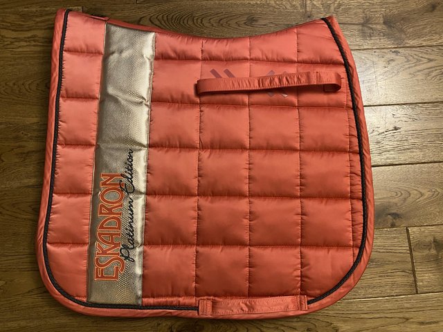 Preview of the first image of Eskadron Platinum coral big square dressage pad + bandages.