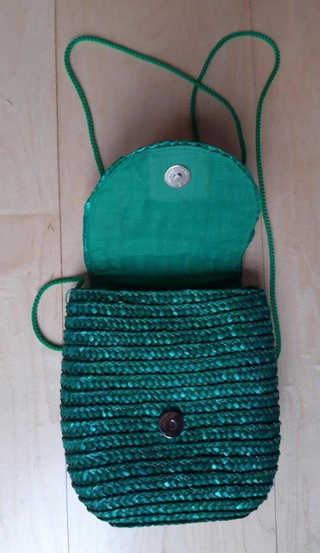 Preview of the first image of GREEN RATTAN HANDBAG small.